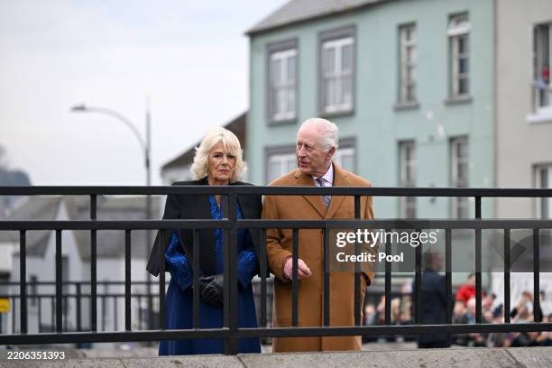 Queen Camilla and King Charles III walk through Banbridge during an official visit to Northern Ireland on March 21, 2025 in Banbridge, Northern...