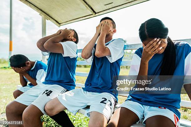 the losing team in the soccer field - mistake stock pictures, royalty-free photos & images