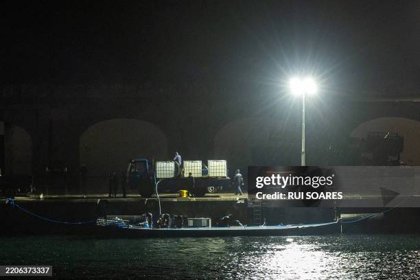 Picture taken on March 25, 2025 at Ponta Delgada harbour in Sao Miguel island in Azores, shows a semi-submersible submarine intercepted while...