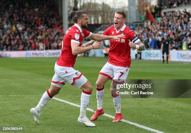 Jay Rodríguez of Wrexham celebrates scoring his team's first goal with James McClean during the Sky Bet League One match between Wrexham AFC and...