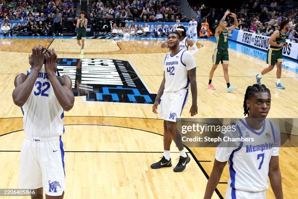 Moussa Cisse of the Memphis Tigers and teammates react as Nique Clifford of the Colorado State Rams and teammates celebrate their 78-70 win in the...