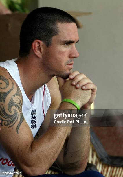 England cricketer captain Kevin Pietersen watches his team-mates play during a warm-up match against Mumbai XI at The Brabourne Cricket Stadium in...