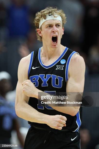 Richie Saunders of the Brigham Young Cougars celebrates after his three-point basket against the Wisconsin Badgers during the second half in the...