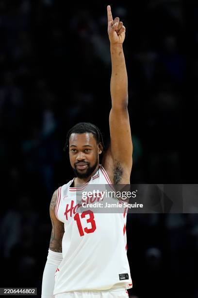 Wan Roberts of the Houston Cougars celebrates after defeating the Gonzaga Bulldogs 81-76 in the second round of the NCAA Men's Basketball Tournament...