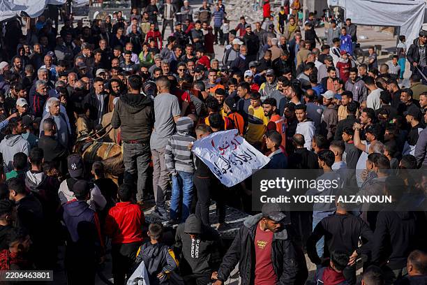 Palestinians chant slogans during an anti-Hamas protest, calling for an end to the war with Israel, in Beit Lahia in the northern Gaza Strip on March...