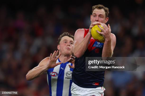 Harrison Petty of the Demons marks the ball marks the ball during the round two AFL match between North Melbourne Kangaroos and Melbourne Demons at...