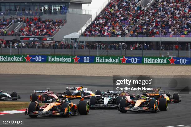 Oscar Piastri of Australia driving the McLaren MCL39 Mercedes leads Lando Norris of Great Britain driving the McLaren MCL39 Mercedes George Russell...
