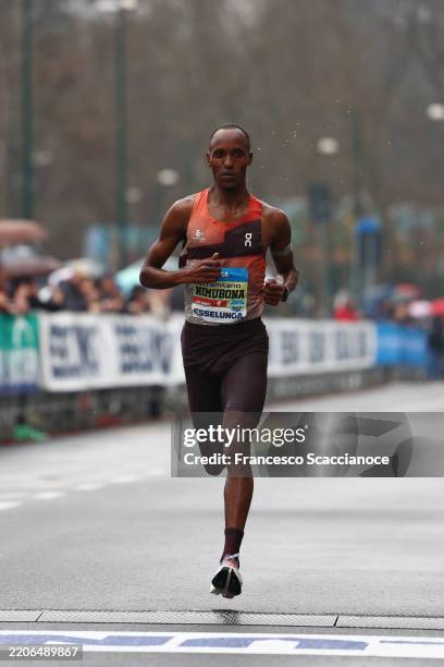 Yves Nimubona of Rwanda crosses the finish line in second place during the Stramilano Half Mararhon on March 23, 2025 in Milan, Italy.