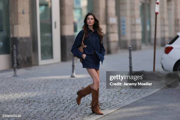 Celine Bethmann seen wearing Cie Cie oversized dark-wash denim button-up western-inspired shirt with a relaxed fit, matching Cie Cie high-waisted...