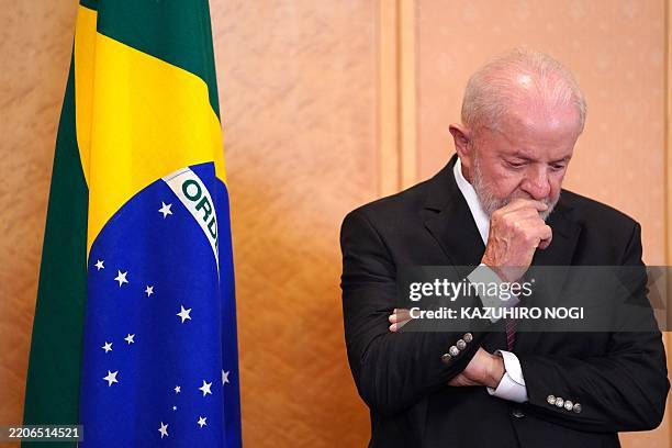 Brazil's President Luiz Inacio Lula da Silva thinks before going to his press conference in Tokyo on March 27, 2025.