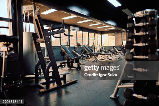Empty gym with exercise equipment waiting for athletes Empty gym with exercise equipment waiting for athletes