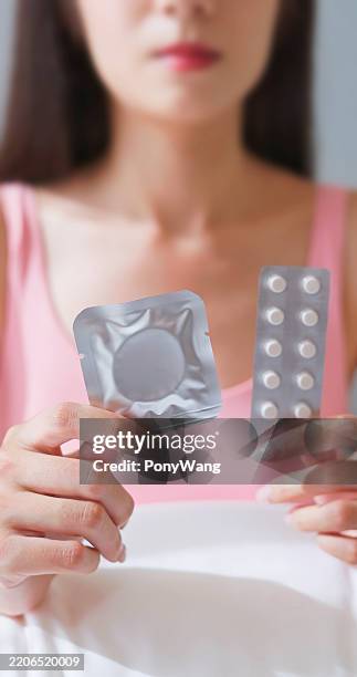 asian woman contraception options - women wearing latex stock pictures, royalty-free photos & images