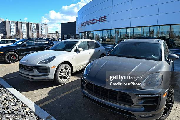 Porsche cars are displayed outside a Porsche dealership in Edmonton, Alberta, Canada, on March 22, 2025.