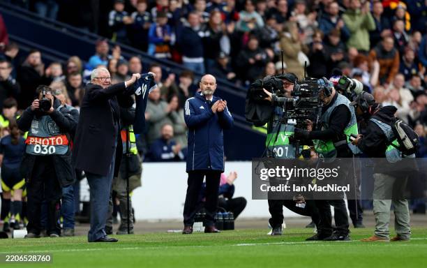Sir Alex Ferguson presents a shirt in memory of Denis Law, former Scotland player prior to the UEFA Nations League 2024/25 League A/B Play-offs...