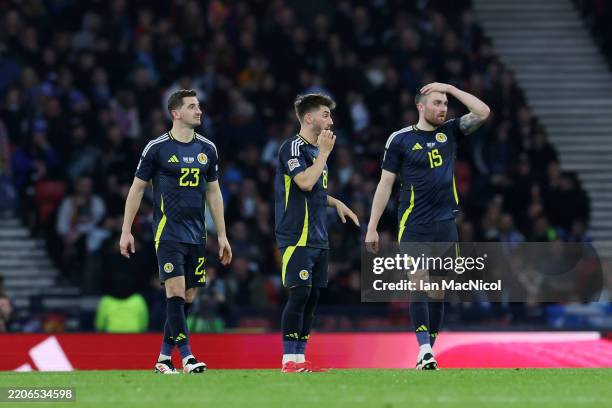 Billy Gilmour, John Souttar and Kenny McLean of Scotland react after Christos Tzolis of Greece scored their sides third goal during the UEFA Nations...