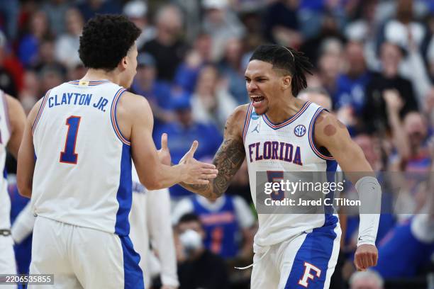 Walter Clayton Jr. #1 and Will Richard of the Florida Gators celebrate in the second half against the Connecticut Huskies in the second round of the...