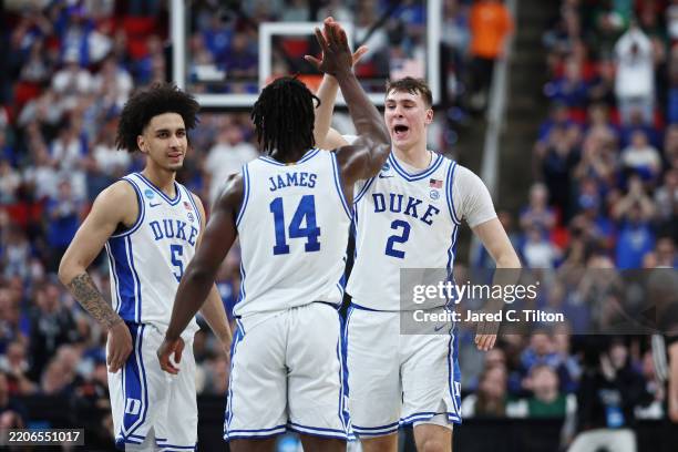 Tyrese Proctor, Sion James, and Cooper Flagg of the Duke Blue Devils celebrate in the first half against the Baylor Bears in the second round of the...