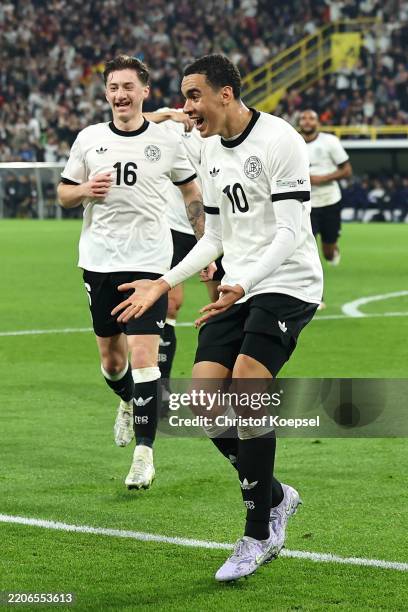 Jamal Musiala of Germany celebrates scoring his team's second goal during the UEFA Nations League Quarterfinal Leg Two match between Germany and...