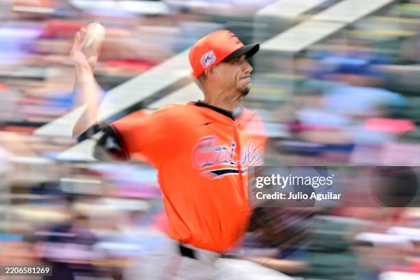 Charlie Morton of the Baltimore Orioles delivers a pitch in the second inning against the Atlanta Braves during a Grapefruit League spring training...