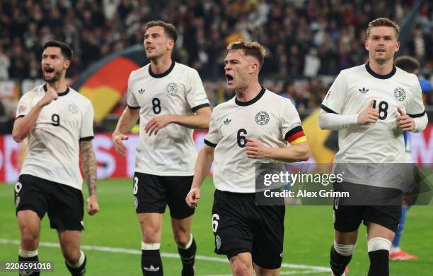 Joshua Kimmich of Germany celebrates the team's first goal during the UEFA Nations League Quarterfinal Leg Two match between Germany and Italy at...