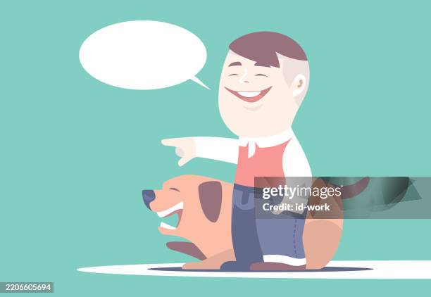 little boy laughing and pointing with dog - foster stock illustrations