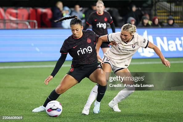 Reya Reyes Reyna Reyes of Portland Thorns FC and Riley Tiernan of Angel City FC ...