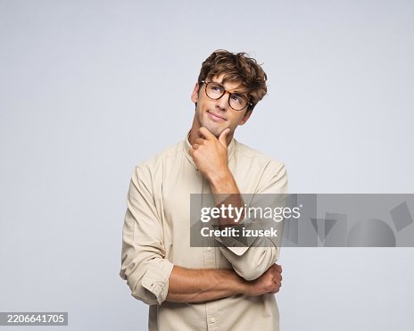 Portrait of pensive businessman, grey background Portrait of pensive businessman, grey background