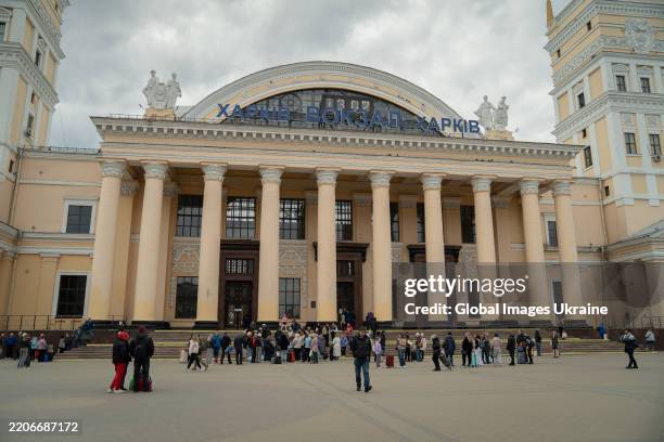 People gather at Kharkiv railway station on March 24, 2025 in Kharkiv, Ukraine. It is temporarily impossible to purchase tickets through the...
