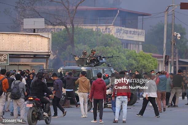 Convoy of the Nepal Army rolls on the road in Kathmandu, Nepal, on March 28 as the pro-monarch protest turns violent. Two people, one protestor and a...