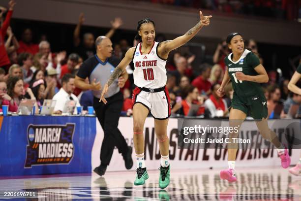 Aziaha James of the NC State Wolfpack reacts to a second half three point basket while playing the Michigan State Spartans in the second round of the...