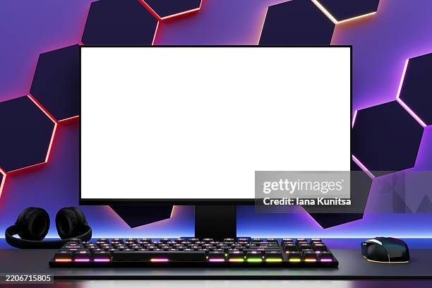 modern gaming setup with 3d computer mockup, white blank screen, rgb keyboard, mouse, and headphones on futuristic neon hexagonal wall background. perfect for esports, streaming, or tech designs. - gaming setup stock pictures, royalty-free photos & images