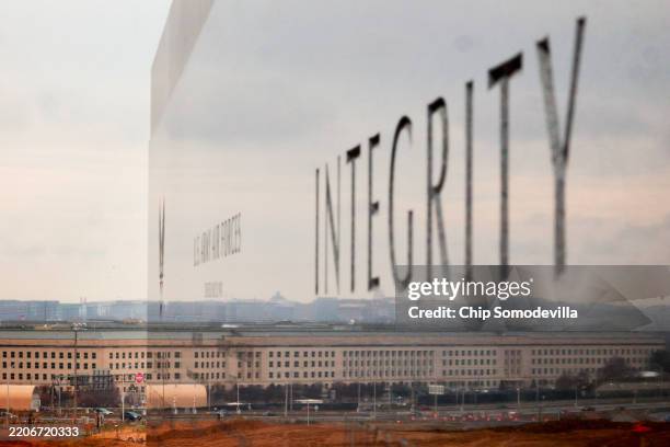 The Pentagon is seen reflected on a polished wall at the U.S. Air Force Memorial on March 24, 2025 in Arlington, Virginia. According to reports, high...