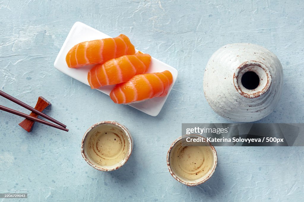 Sake and ochoko,Traditional cup,With salmon sashimi and chopstick