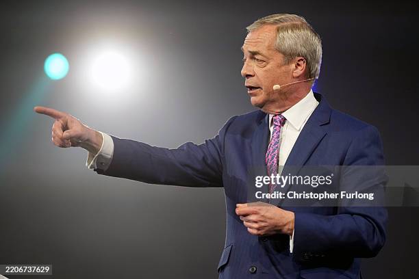 Reform UK leader and MP for Clacton, Nigel Farage is seen on stage during the Reform UK campaign launch rally at the Utilita Arena on March 28, 2025...