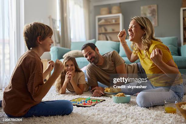 yeah, we are the winners in ludo game! - bordspel stockfoto's en -beelden