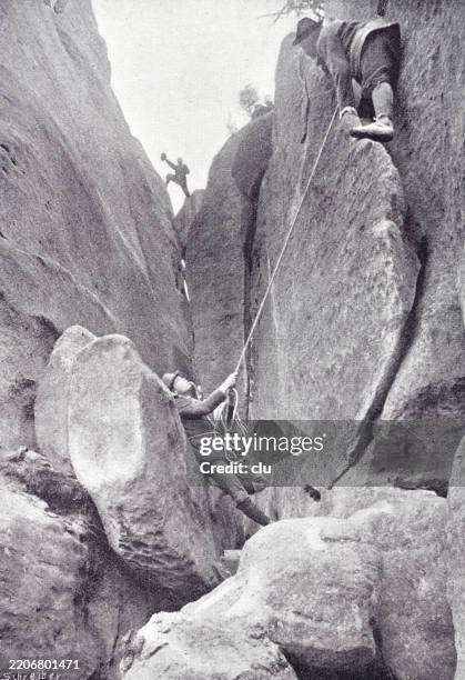 saxon switzerland, falkenstein, schusterweg, short underneath the peak - saxon switzerland national park stock illustrations