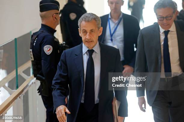 Former French president Nicolas Sarkozy arrives at the Tribunal de Paris courthouse for a hearing in his trial on charges of illegal campaign...