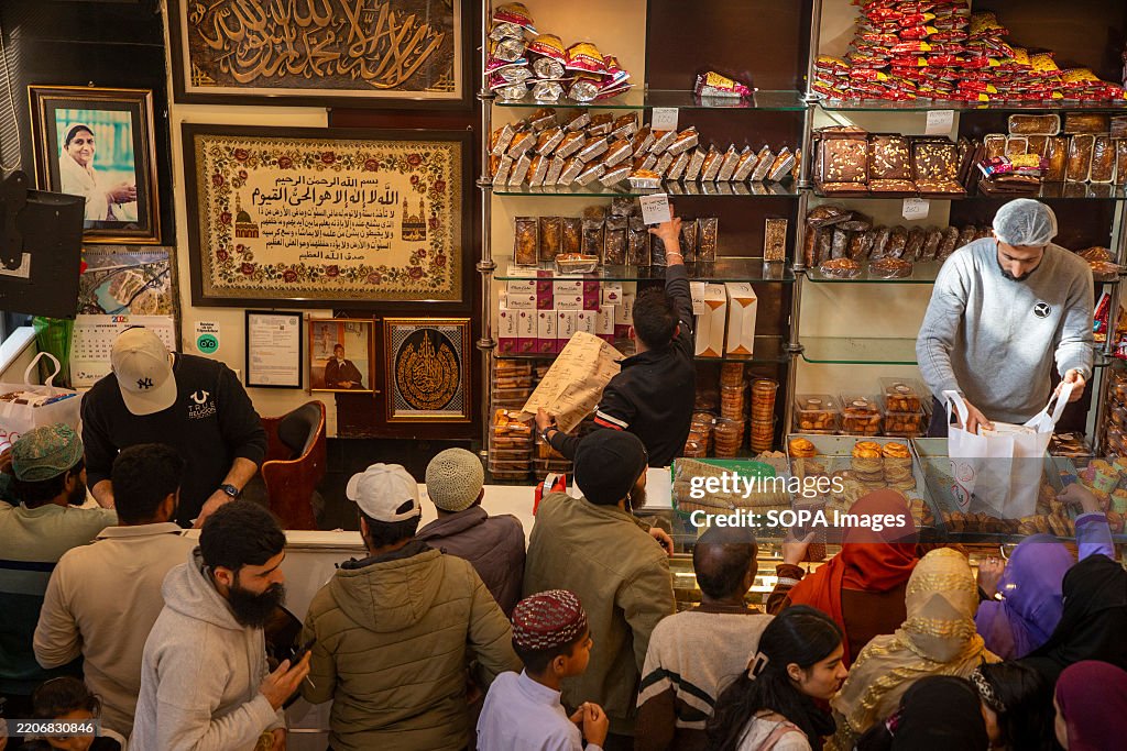 Kashmiri Muslims buy bakery products ahead of the Muslim...