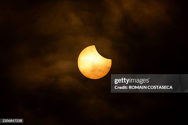 Partial solar eclipse behind the clouds in Clermont-Ferrand France on March 29 2025.