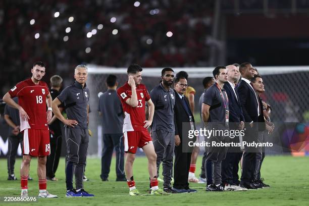 Indonesia players applaud fans after the team's 1-0 victory in the FIFA World Cup qualifier Asian third round Group C match between Indonesia and...