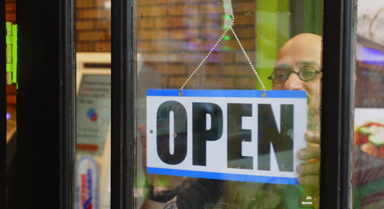 https://media.gettyimages.com/id/2206861904/video/store-owner-opening-for-the-day.jpg?b=1&s=640x640&k=20&c=C0MDhbOOhXxTME11QY6ZGE4QbOljht63S50Rd8xWzXg=