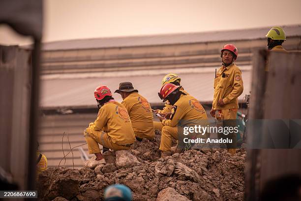 Rescue teams work tirelessly amidst the rubble of a collapsed skyscraper in Bangkok's Chatuchak district following an earthquake in Bangkok, Thailand...