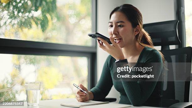 woman using ai voice assistant with education. - speech stock pictures, royalty-free photos & images