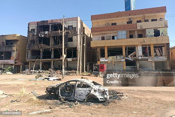 Picture shows damaged buildings in a southern neighbourhood of Khartoum on March 29 after the military recaptured the capital. Khartoum has seen more...