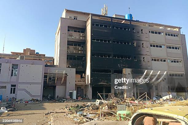 Picture shows damaged buildings in a southern neighbourhood of Khartoum on March 29 after the military recaptured the capital. Khartoum has seen more...