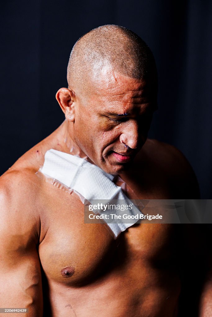 Portrait of serious mature male boxer in studio