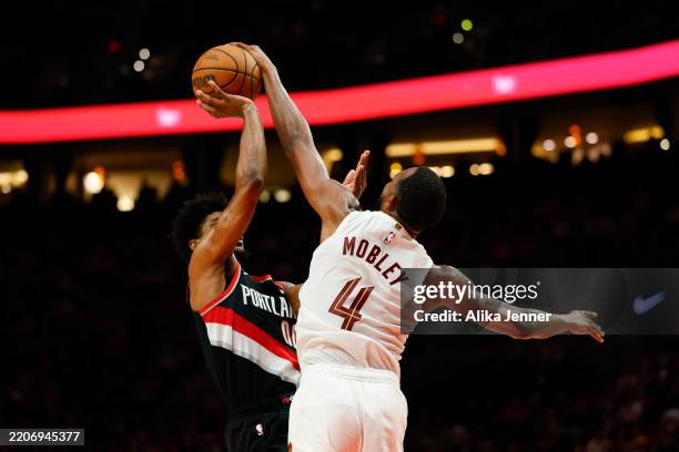 Evan Mobley of the Cleveland Cavaliers blocks Scoot Henderson of the Portland Trail Blazers shot during the fourth quarter of the game at the Moda...