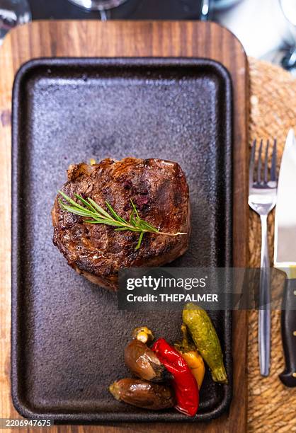 grilled steak with sides on sizzling plate - ribeye steak on grill stock pictures, royalty-free photos & images