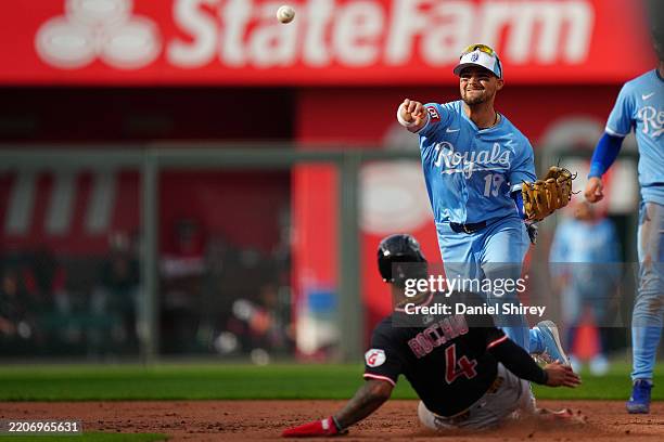 Rob Rocchio Michael Massey of the Kansas City Royals throws over Brayan Rocchio ...