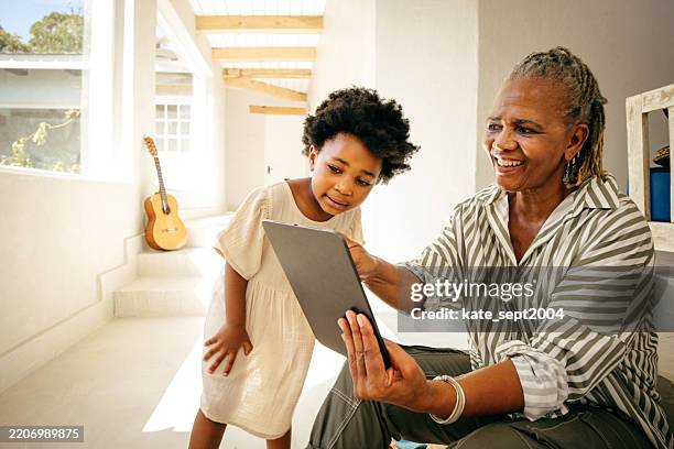 technology brings family closer in this heartwarming scene - legacy concept stock pictures, royalty-free photos & images